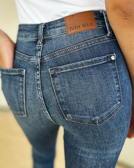 Judy Blue Full Size Mid Waist Distressed Slim Jeans - Trendsi