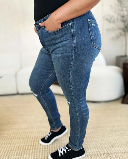 Judy Blue Full Size Mid Waist Distressed Slim Jeans - Trendsi