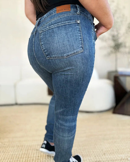 Judy Blue Full Size Mid Waist Distressed Slim Jeans - Trendsi