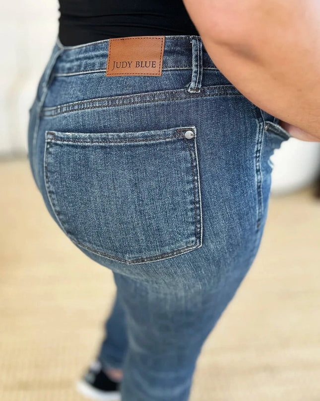 Judy Blue Full Size Mid Waist Distressed Slim Jeans - Trendsi